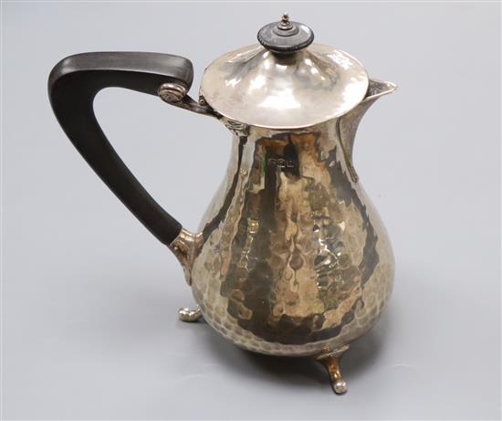 A George V hammered silver hot water pot, Charles Edwards, London, 1920, gross 11 oz.